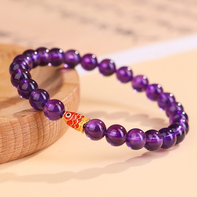 Amethyst Bead Bracelet on wooden.