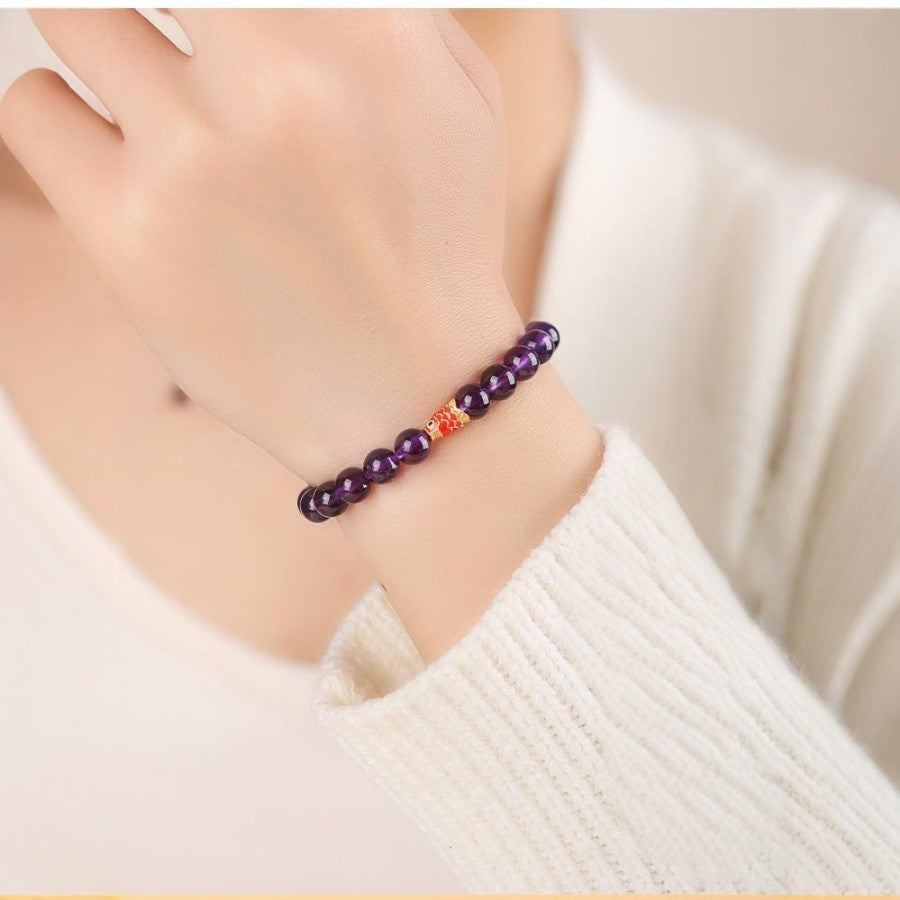 Amethyst Bead Bracelet in hand.