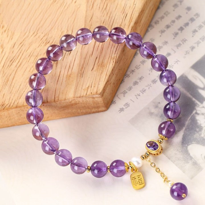 Amethyst bracelet On Table