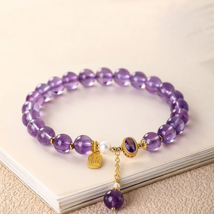 Amethyst bracelet On Table