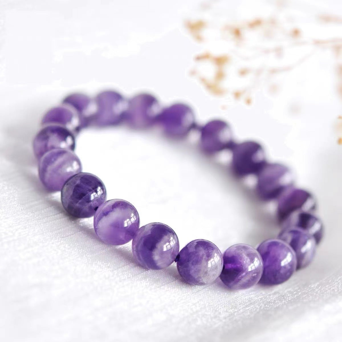 Amethyst Bracelet on white background.