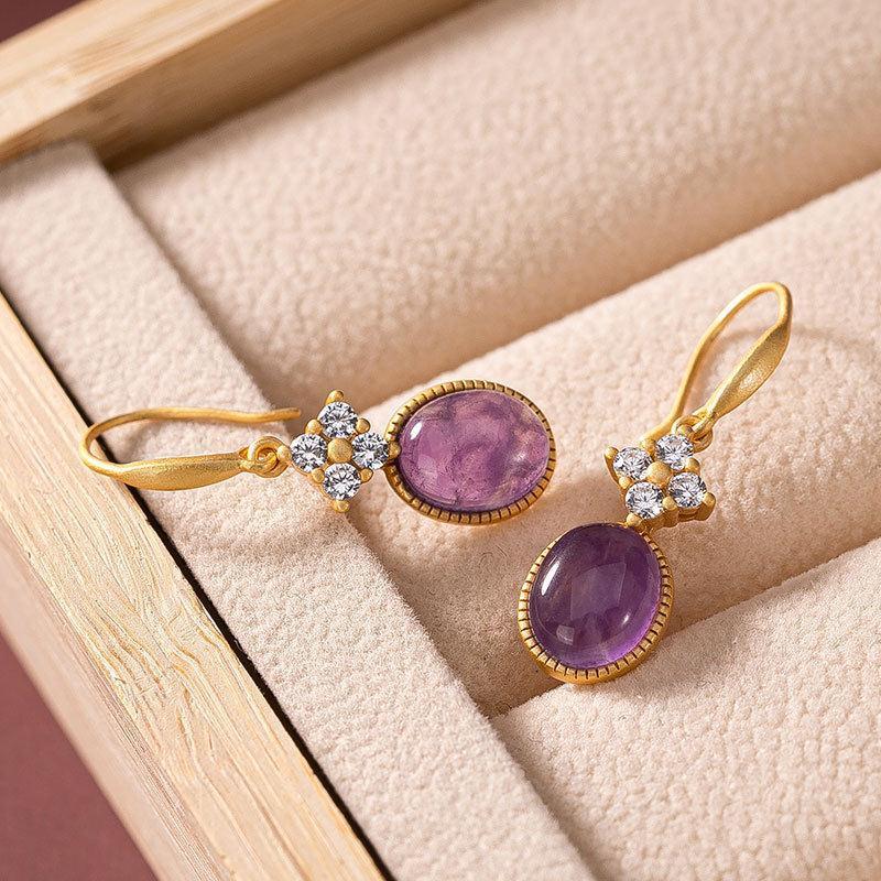amethyst drop earrings On Table