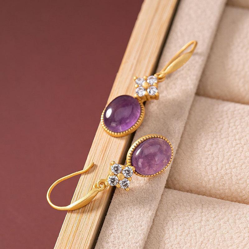 amethyst drop earrings On Table