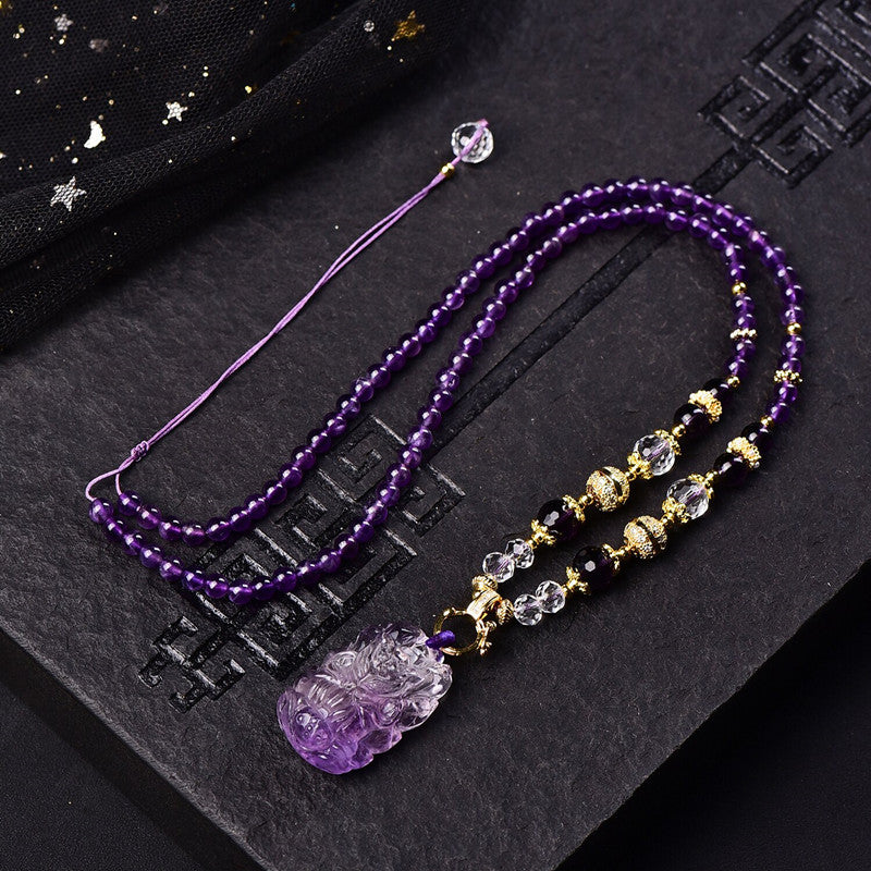 amethyst gemstone necklace with On Table