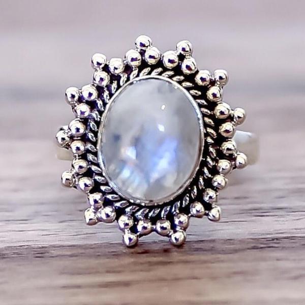 Antique Moonstone Ring with wooden background