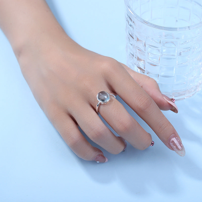 Aquamarine Stone Ring with cyan background