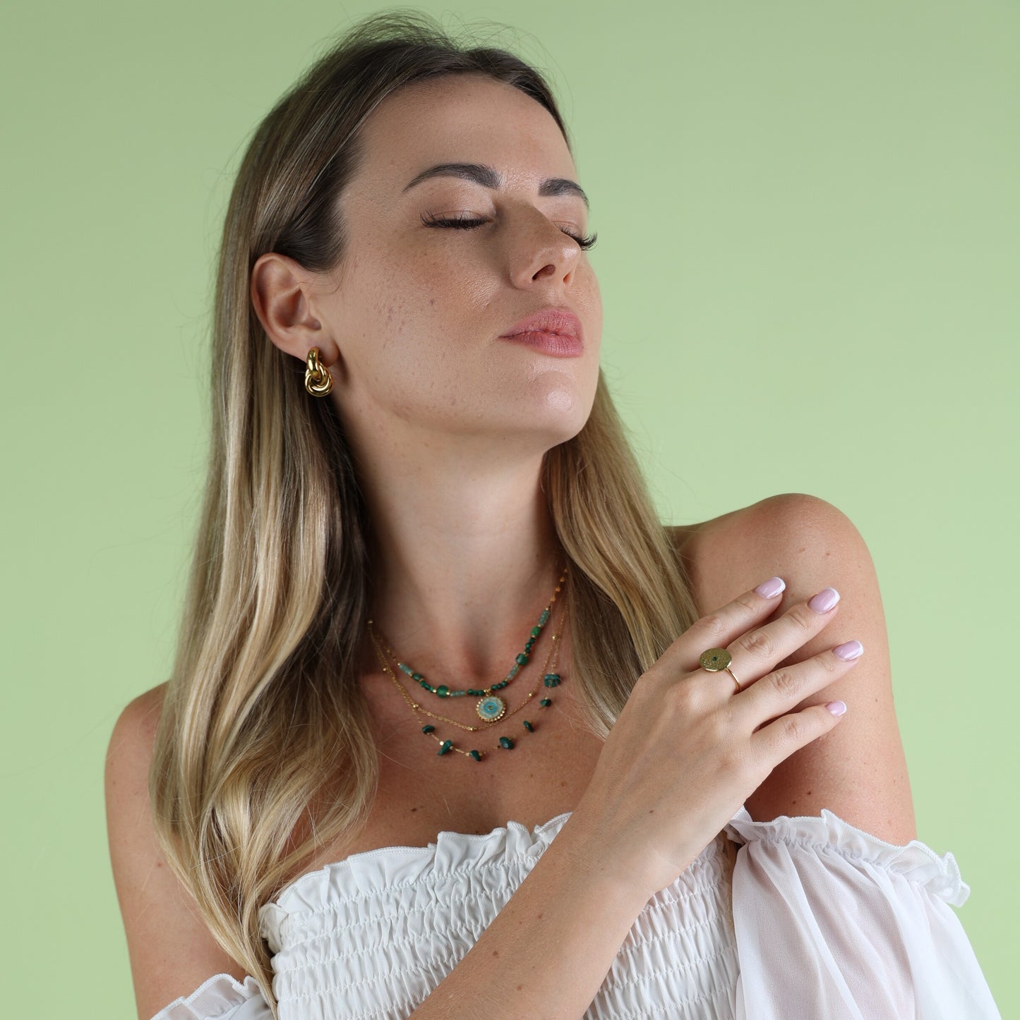green necklace on woman