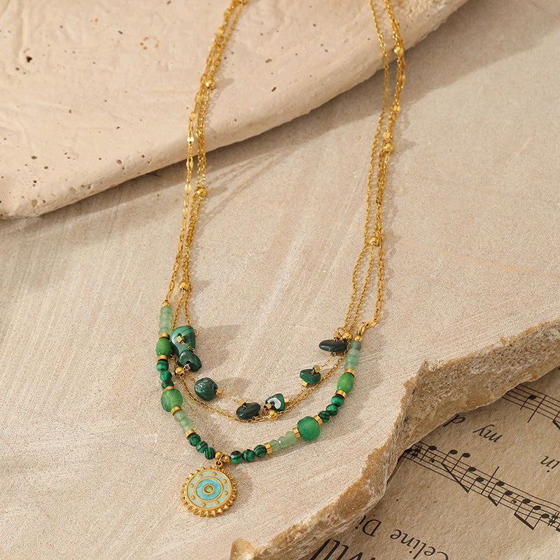 green necklaces on the rock