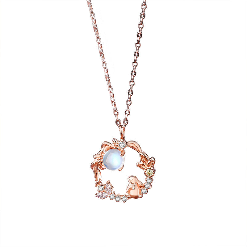 moonstone crystal necklace with white background