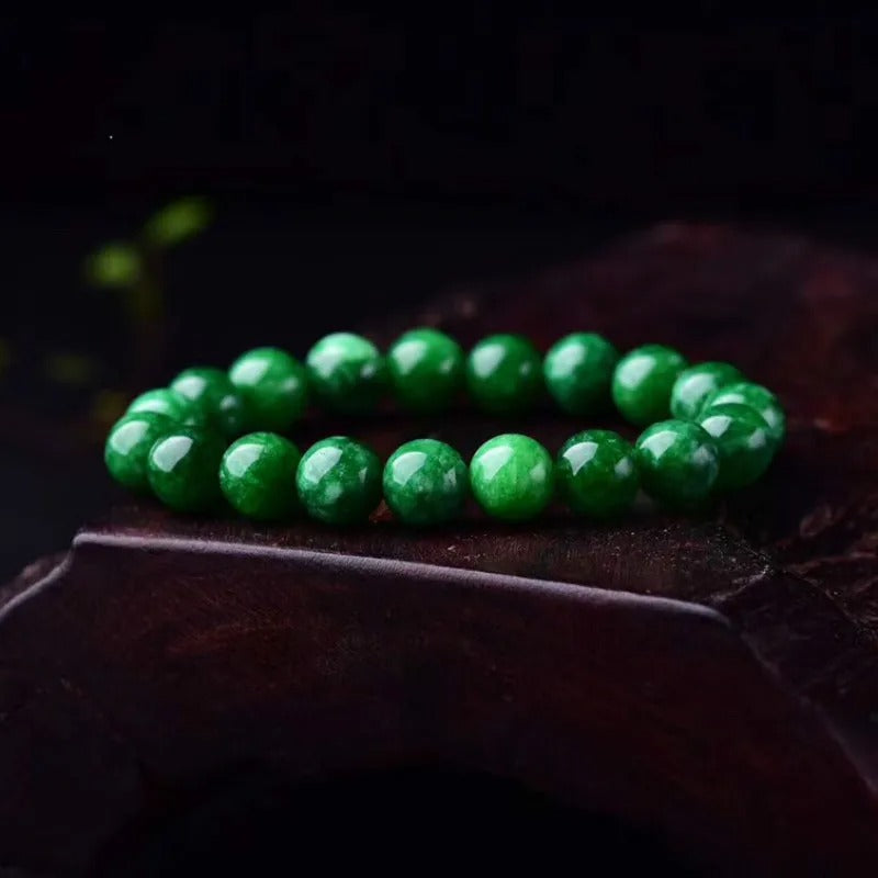 green jade bracelet on the wood