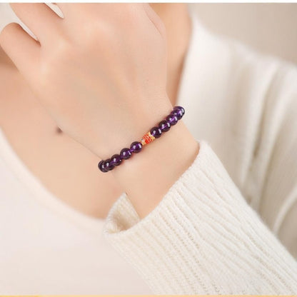Amethyst Bead Bracelet in hand.