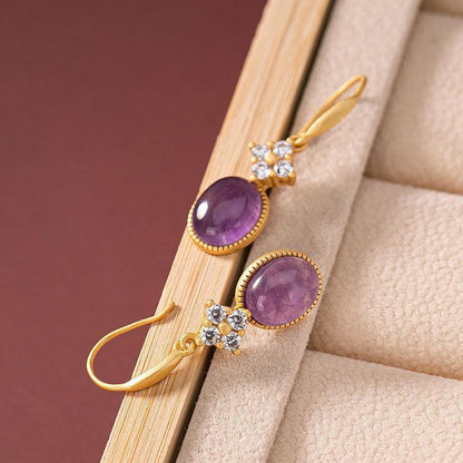 amethyst drop earrings On Table