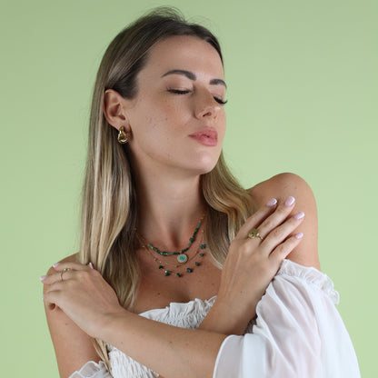 green necklace on woman