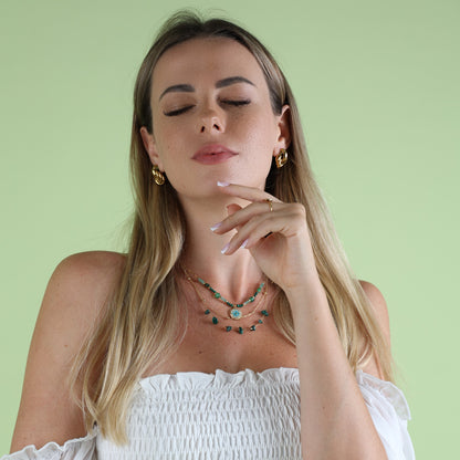 green necklace on woman