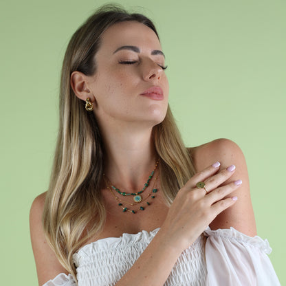 green necklace on woman