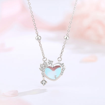 moonstone heart necklace with pink background
