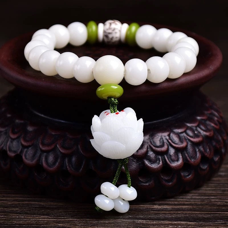 white jade bracelet on the wood
