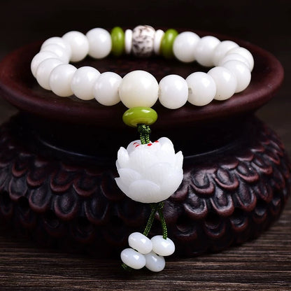white jade bracelet on the wood